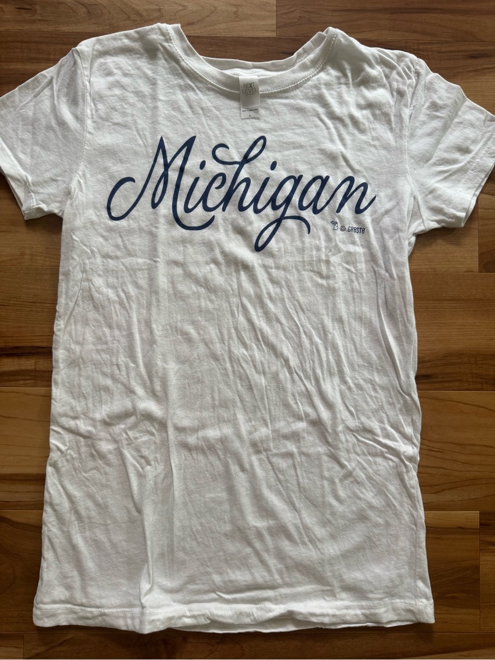 Next Level Apparel White Tee with Subtle Gray Tag Print